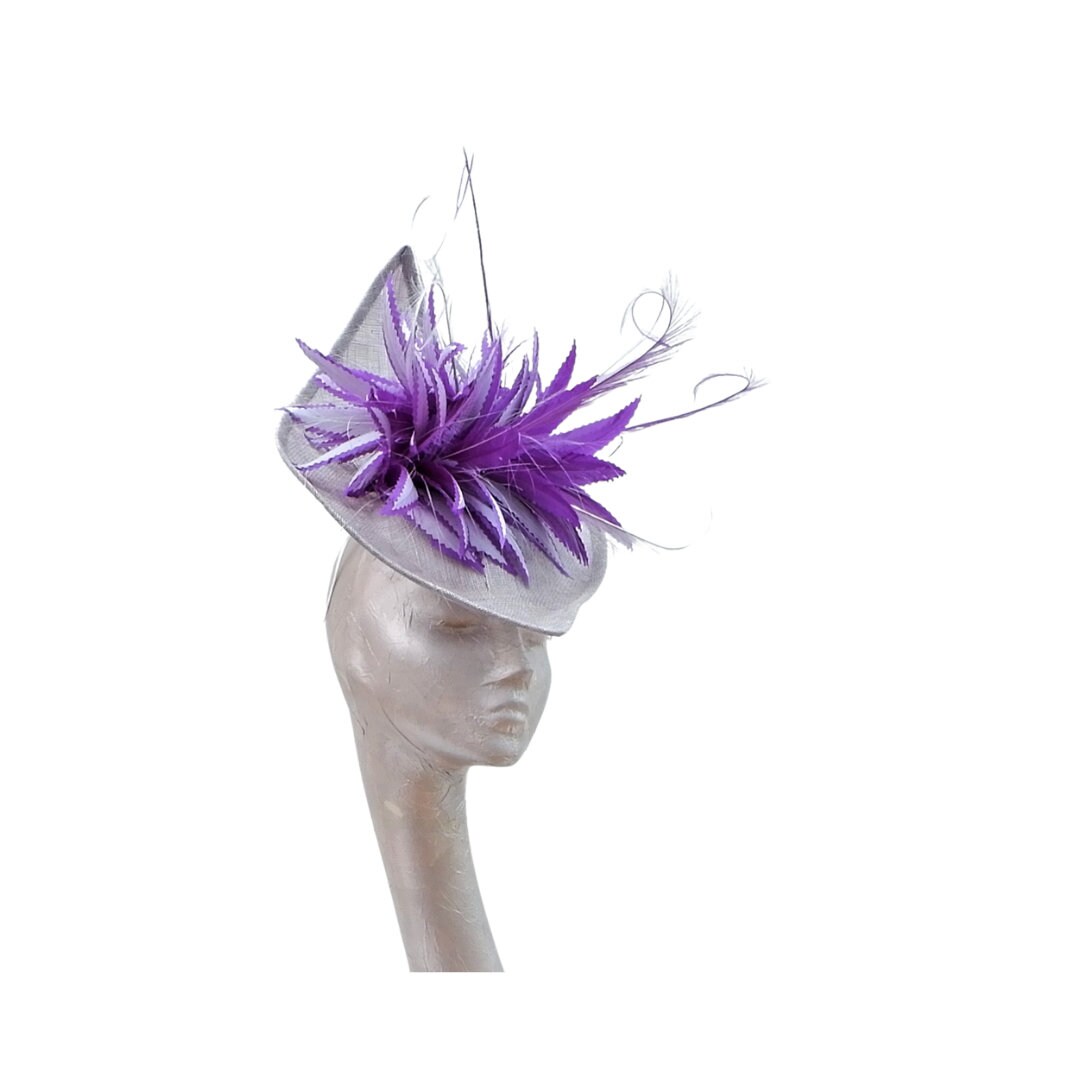 Sika - Irregular Shaped Silver hatinator with Silver & Purple feather detail.