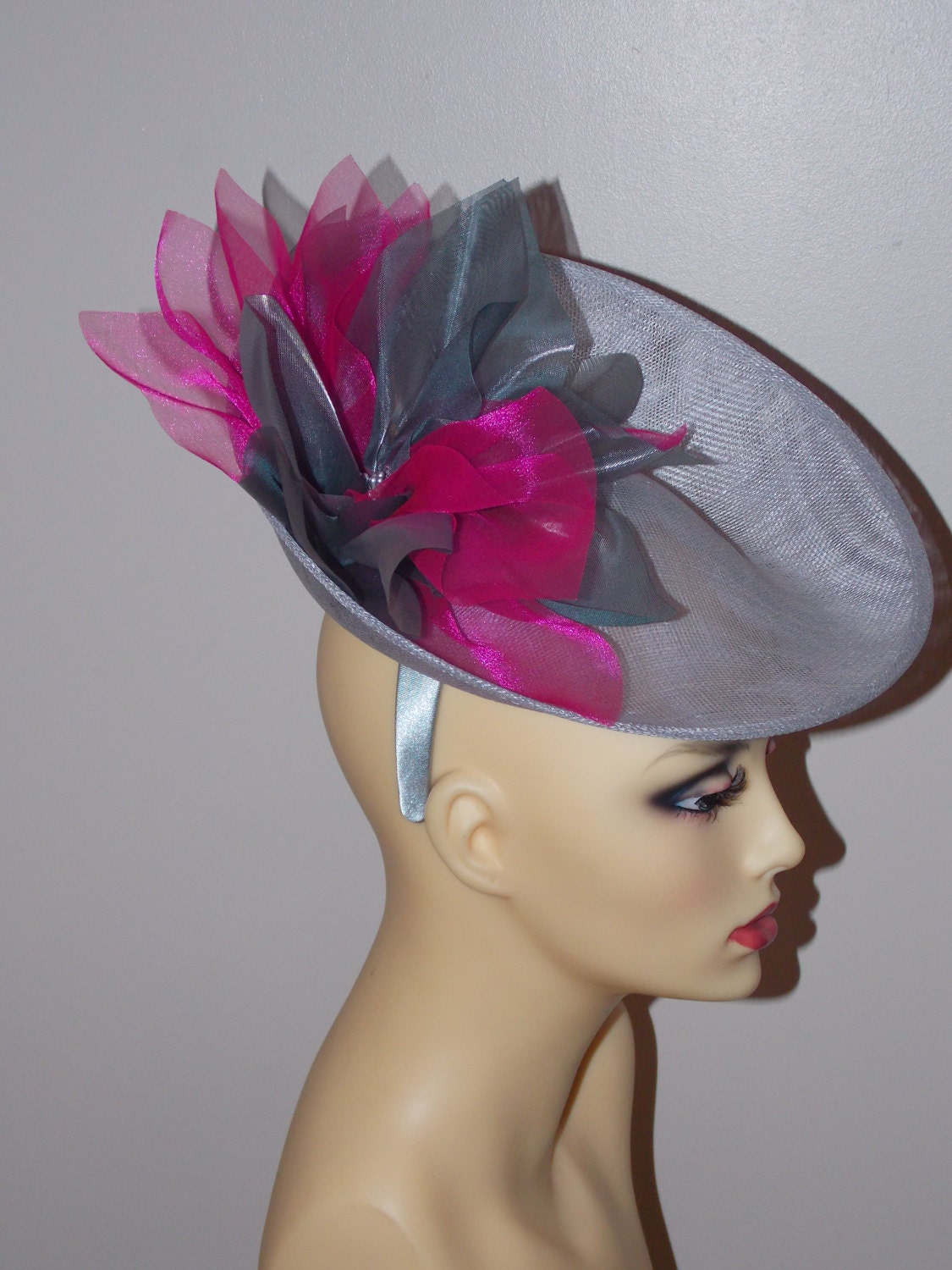 Silver Grey uptured saucer with Cerise & Silver organza flower  by Hats2go