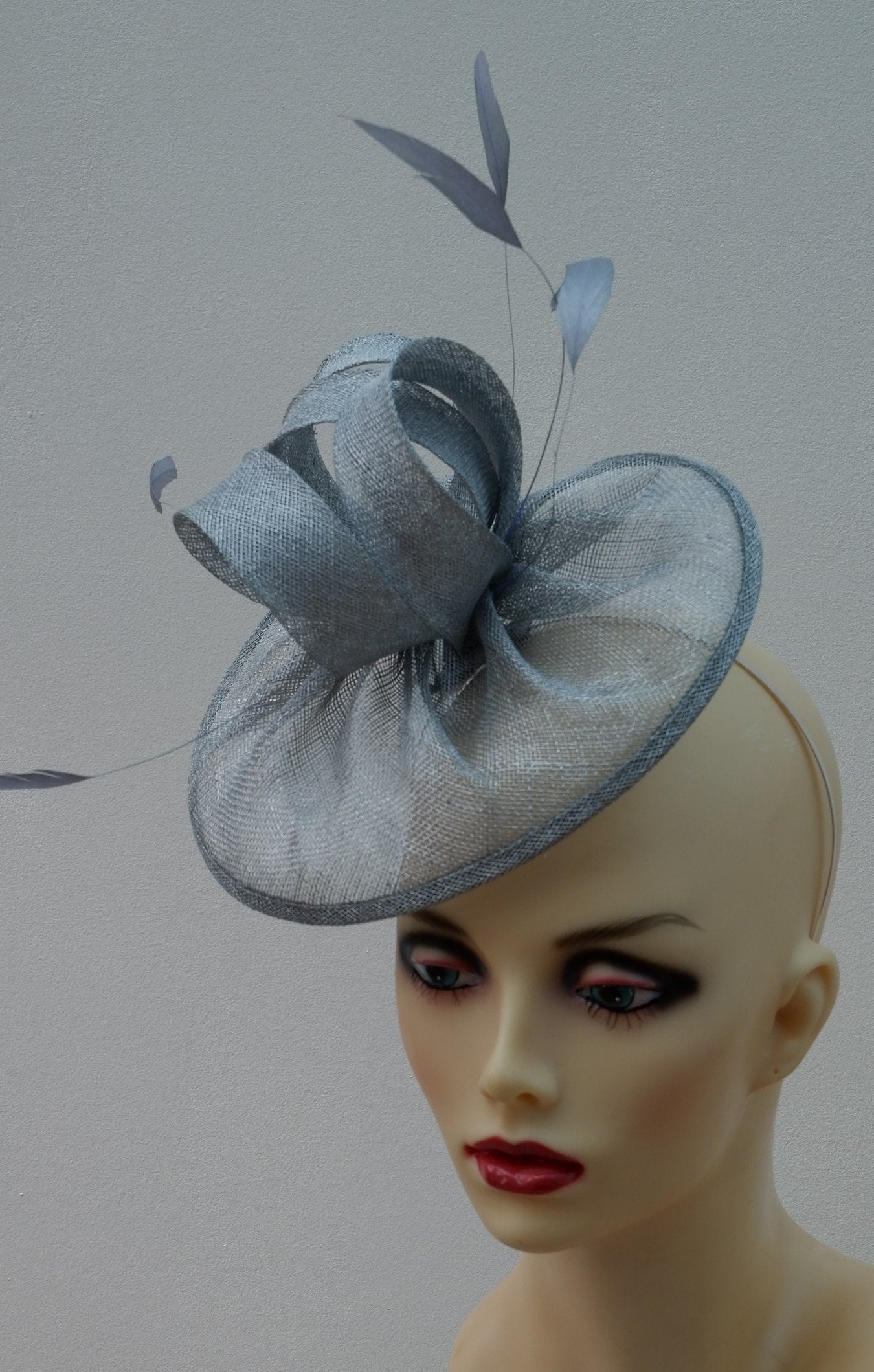Metallic Silver heart shaped Sinamay fascinator