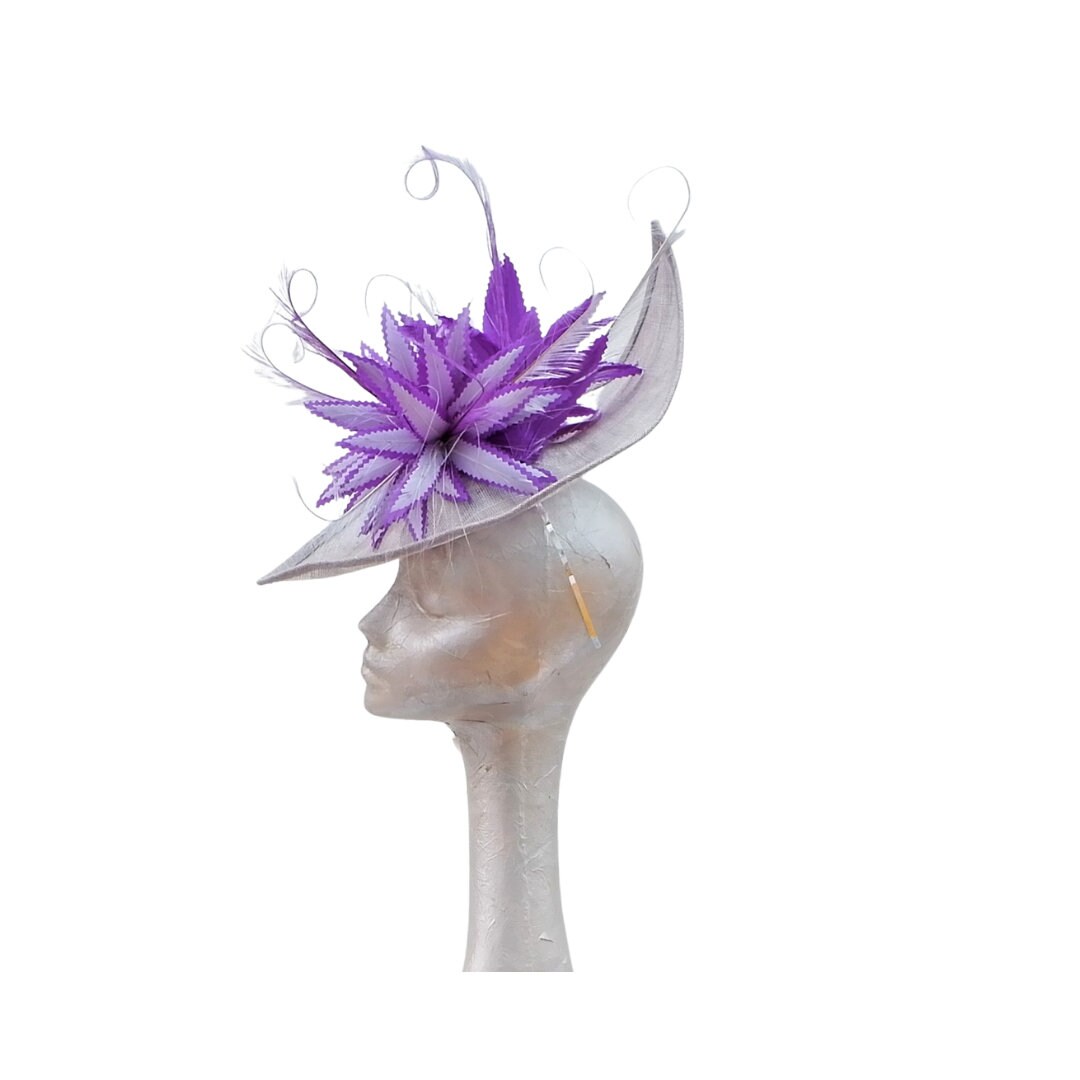 Sika - Irregular Shaped Silver hatinator with Silver & Purple feather detail.