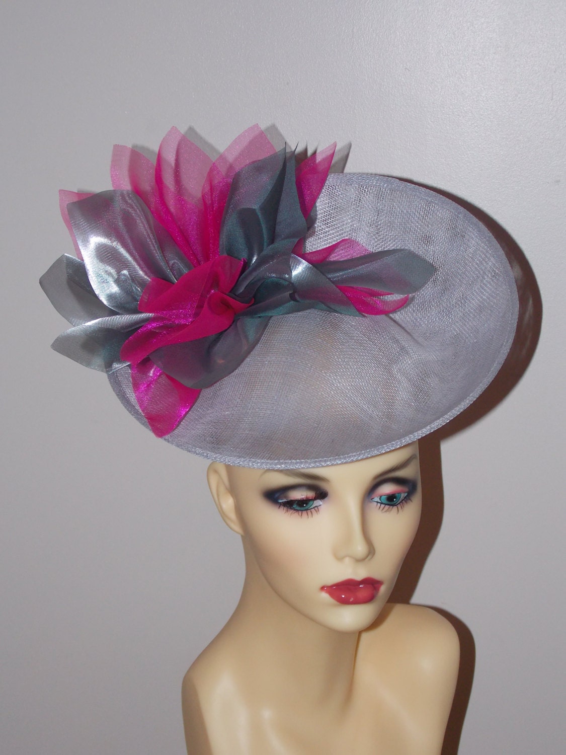Silver Grey uptured saucer with Cerise & Silver organza flower  by Hats2go